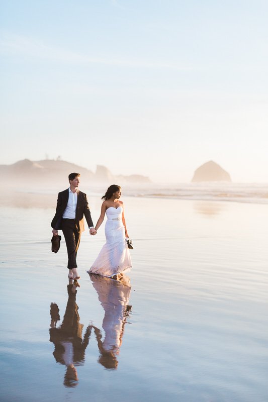 wedding couple walking along Oregon coast venue